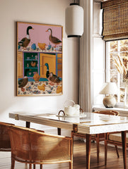 Surreal kitchen art print with mallards and yellow ducks surrounded by floral teapots and cups on a, in a styled room mockup