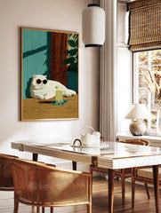 Illustrative print of a white cat in sunglasses with a lime drink, against a teal wall and wooden, in a styled room mockup
