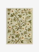 Botanical wall art print featuring white flowers and green leaves on a pale green background