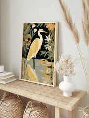 White heron bird with golden-yellow plumage in water, surrounded by dark green and orange, in an alternate framed mockup