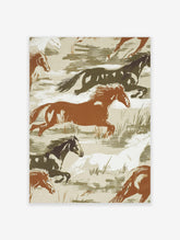 Illustrative print of wild horses galloping in brown, white, and dark green tones on a beige background