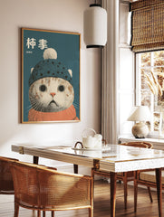 Illustrative Cat Wall Art print featuring a cat wearing a blue knitted hat with a pom-pom and an orange scarf on a teal background. - Image 2