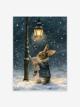 Watercolor illustration of a brown rabbit in a blue coat reading a newspaper under a lit streetlamp during a snowfall