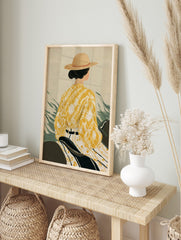 Illustrative art print of a woman in a straw hat and yellow patterned kimono-style top from, in an alternate framed mockup