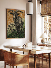 Woodcut style print of a ram goat with large horns in grass and flowers, brown and green background, in a styled room mockup
