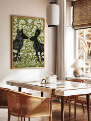 Black fox and rabbit facing each other in a green and white linocut style woodland animal wall art print with flowers. - Image 2