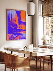 Abstract art print with distressed textures in bold orange, deep purple, and light blue hues, in a styled room mockup