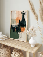 Abstract art print with blocks of dark green, peach, and charcoal, textured brushstrokes, and, in an alternate framed mockup