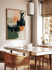 Abstract art print with blocks of dark green, peach, and charcoal, textured brushstrokes, and fine, in a styled room mockup