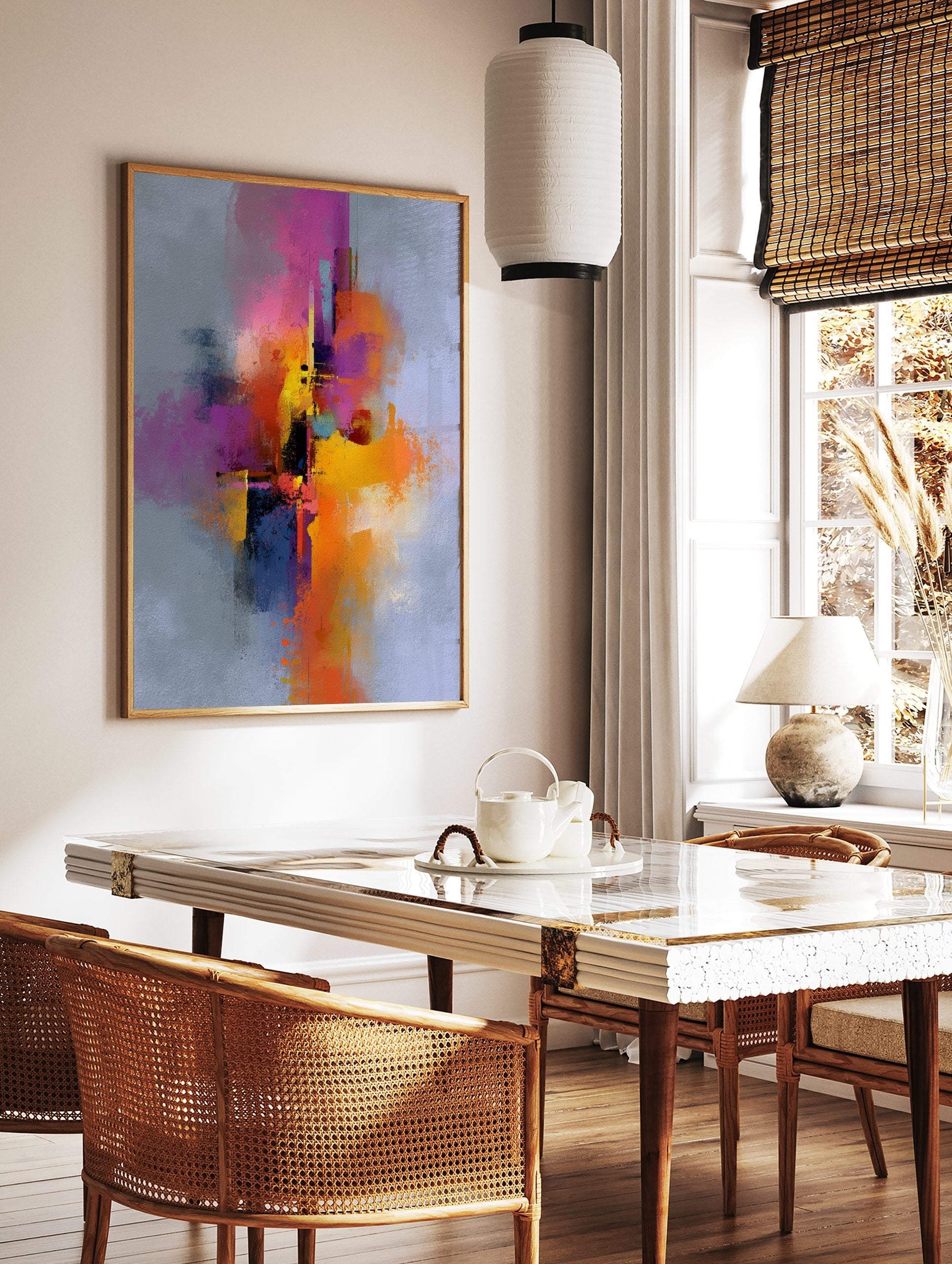 Abstract art print with vibrant fuchsia, yellow, orange, and blue brushstrokes on a light grey, in a styled room mockup