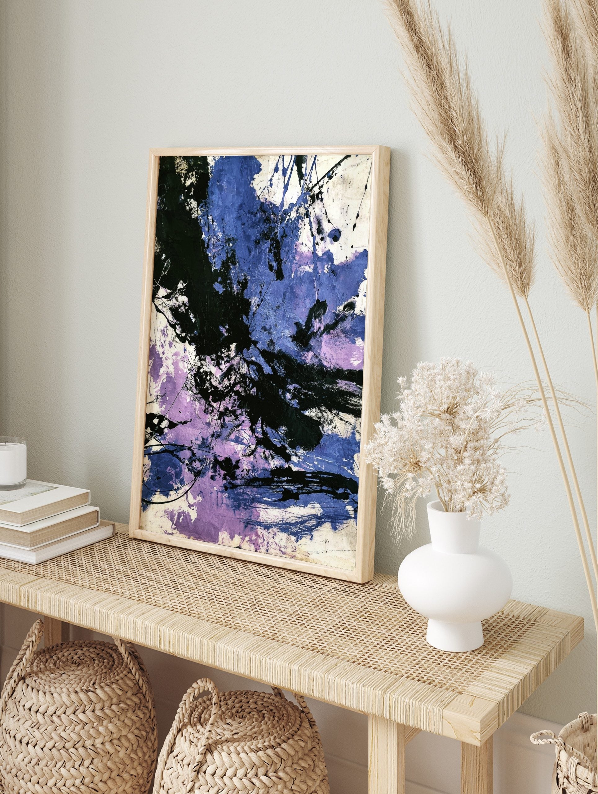 Abstract painting with dynamic black, blue, and purple paint splashes and energetic, in an alternate framed mockup