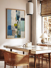 Abstract blocks wall art with textured blue, green, white, and yellow rectangular shapes in a, in a styled room mockup