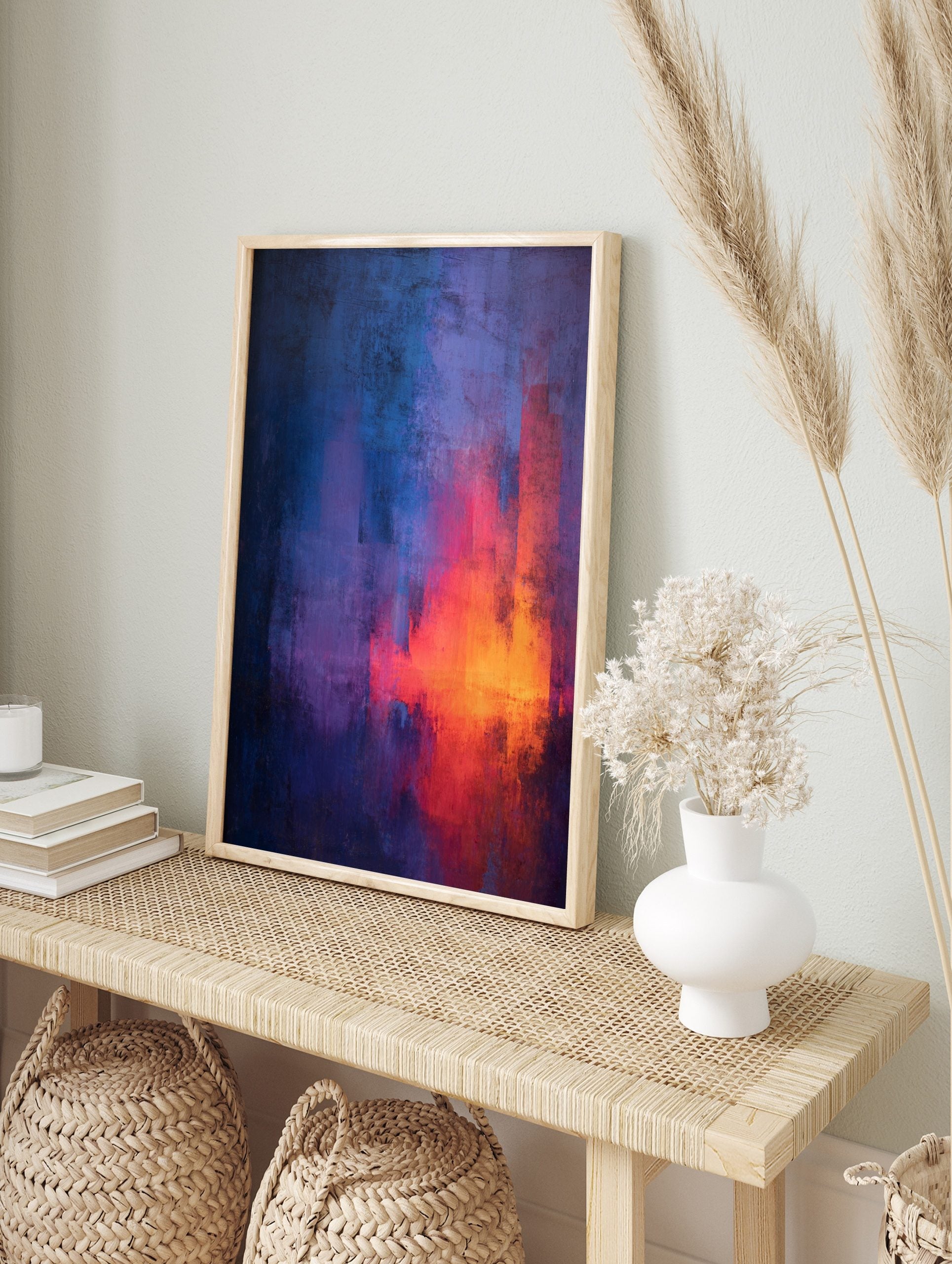 Abstract painting with vertical streaks of blue, purple, red, and orange, showing textured, in an alternate framed mockup