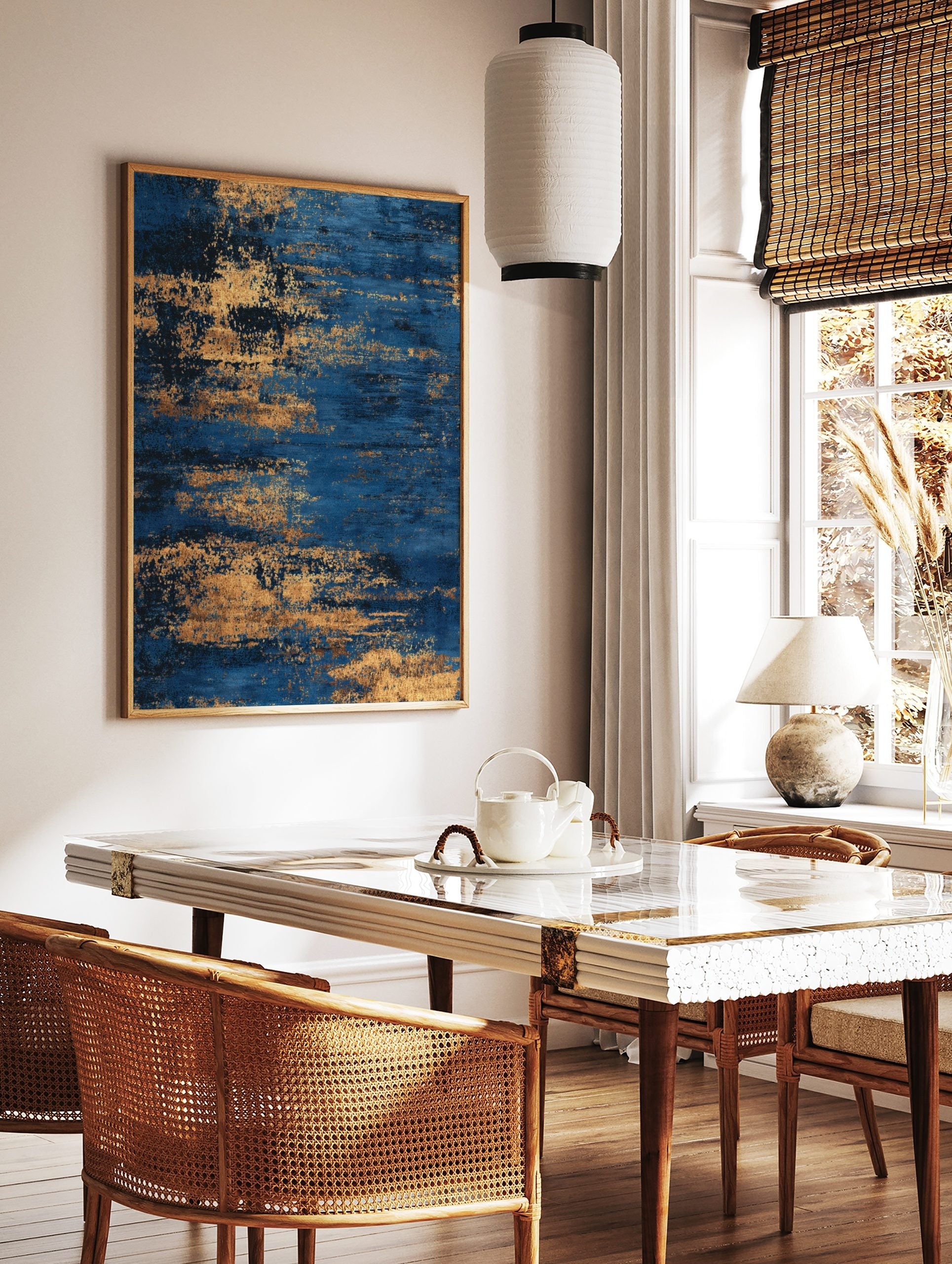 Abstract blue and gold textured wall art print with horizontal streaky patterns, in a styled room mockup