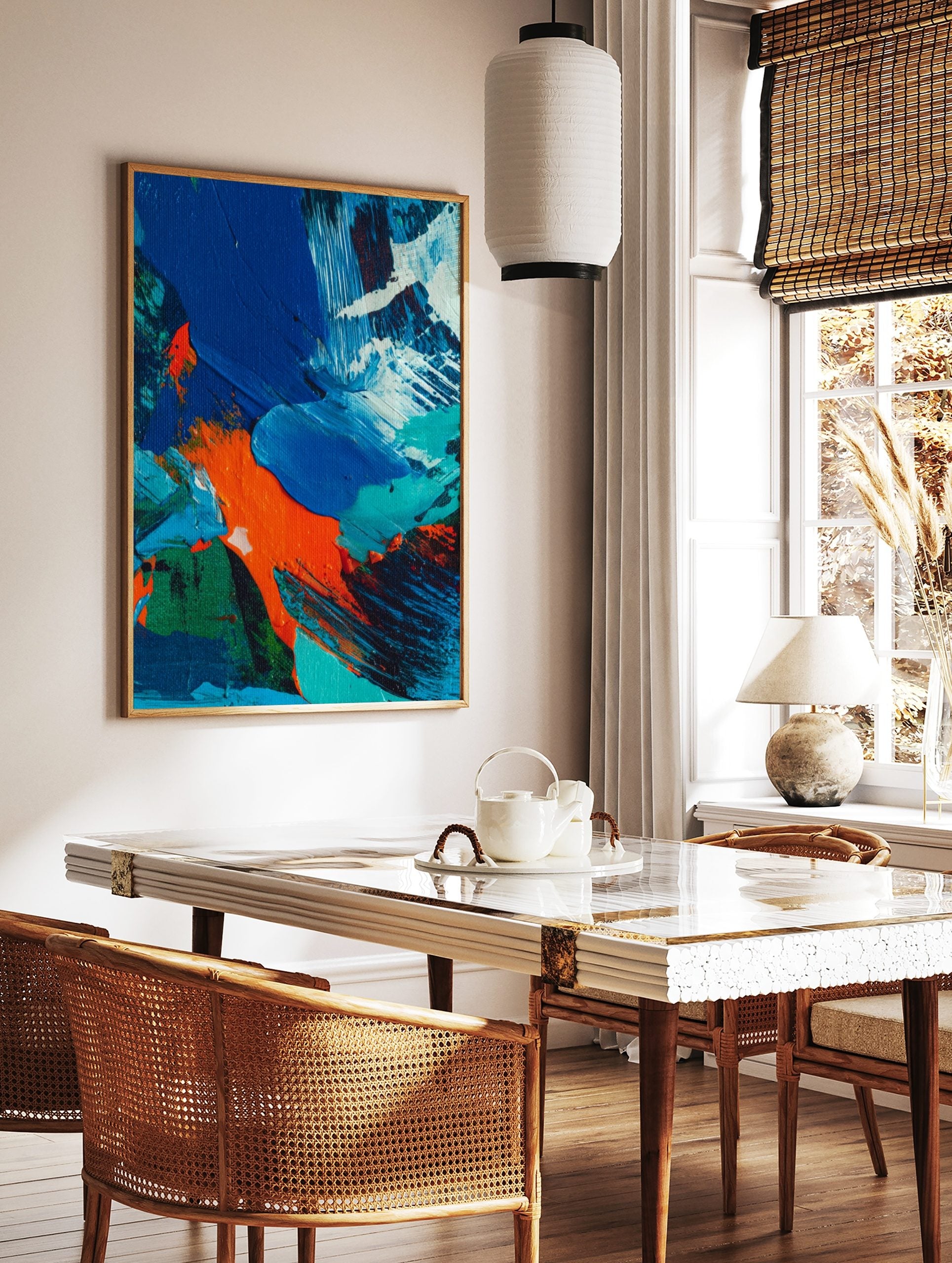Close-up of abstract painting with textured blue, orange, green, and white paint strokes, in a styled room mockup