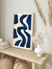 Abstract navy blue wavy shapes on a cream background, minimalist wall art print, in an alternate framed mockup