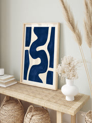 Abstract blue wave shapes on a cream background, minimalist wall art print, in an alternate framed mockup