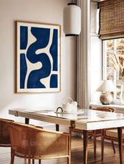 Abstract blue wave shapes on a cream background, minimalist wall art print, in a styled room mockup