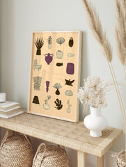 Grid of 16 illustrative abstract botanical, furniture, and vessel designs in brown and purple, in an alternate framed mockup