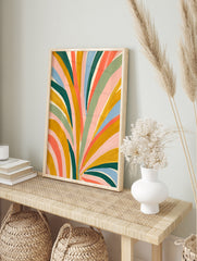 Abstract botanical art print with colourful painted leaf shapes in mustard, green, pink, and, in an alternate framed mockup