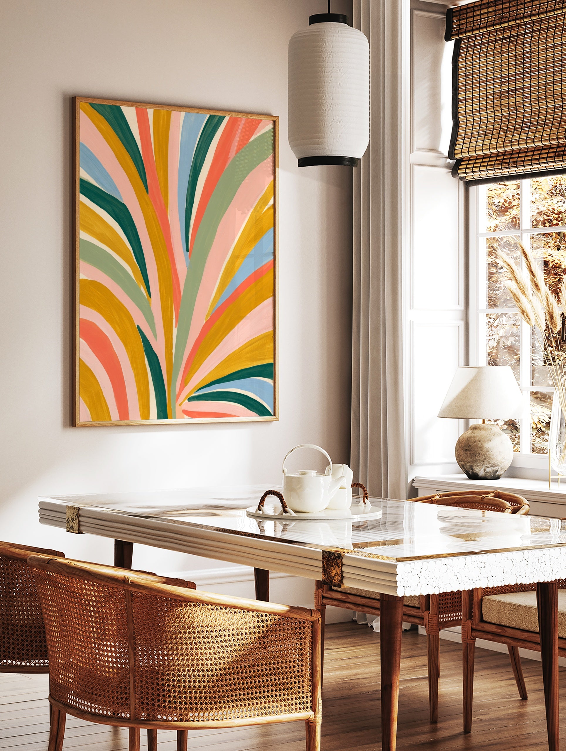 Abstract botanical art print with colourful painted leaf shapes in mustard, green, pink, and blue, in a styled room mockup