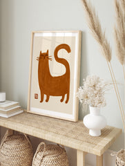 Minimalist brown cat illustration with brush-stroke texture and red seal on an off-white, in an alternate framed mockup