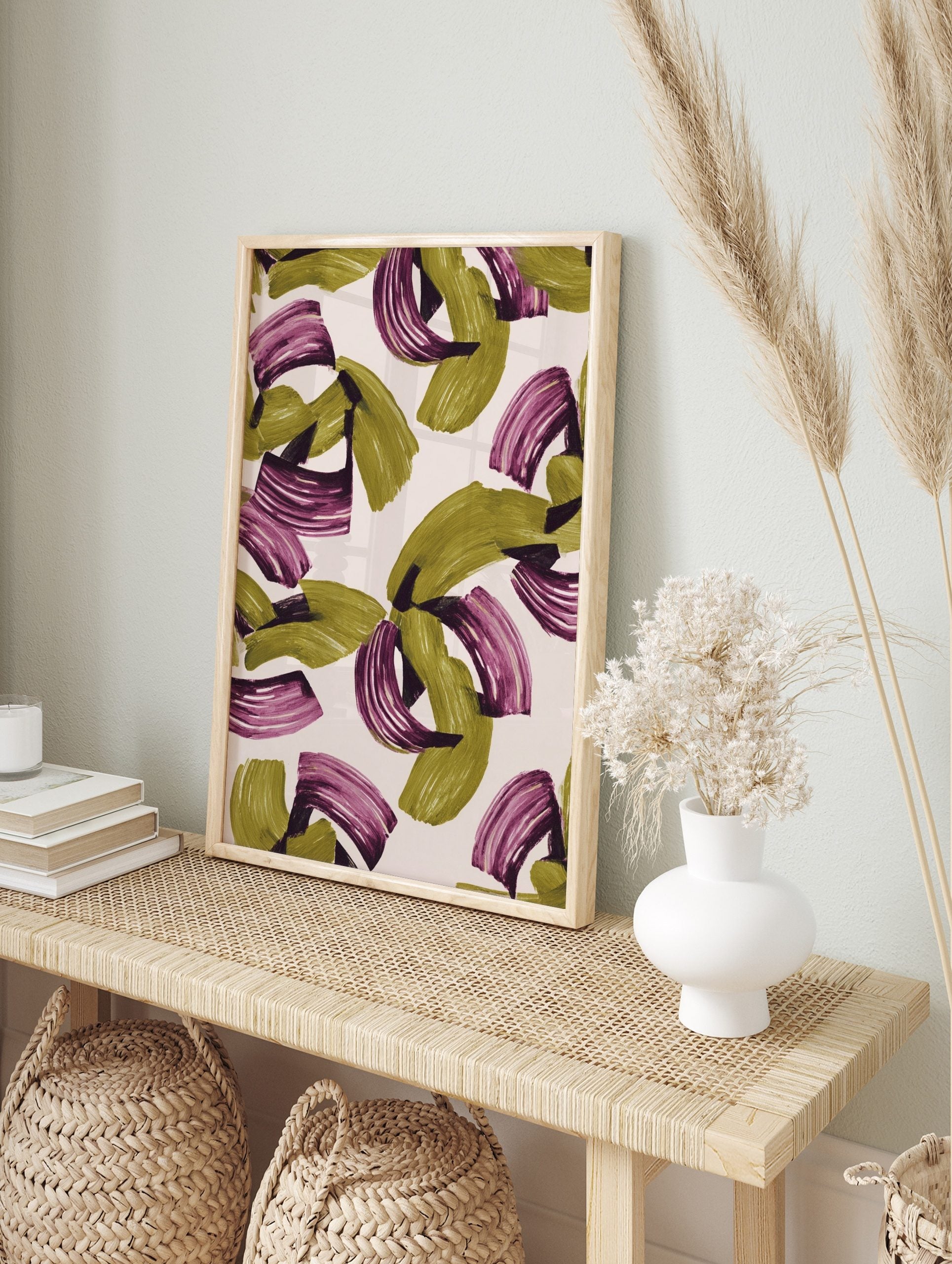 Abstract wall art print with olive green and magenta sweeping brushstrokes on a light, in an alternate framed mockup