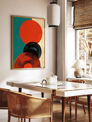 Abstract circles graphic print featuring orange-red and black concentric shapes on teal and beige, in a styled room mockup