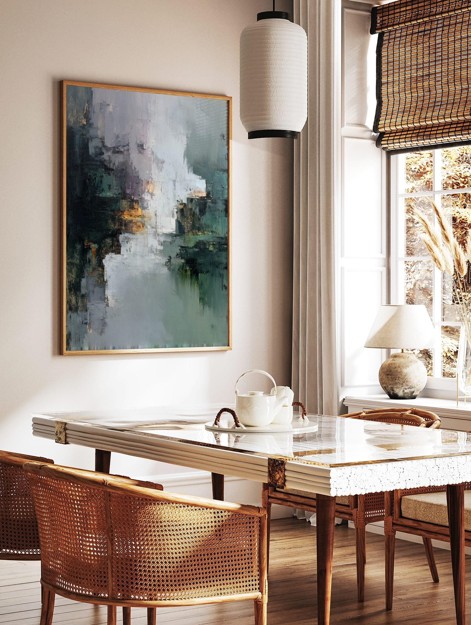 Textured abstract art print with dark green, grey, white, and orange, suggesting a reflective, in a styled room mockup