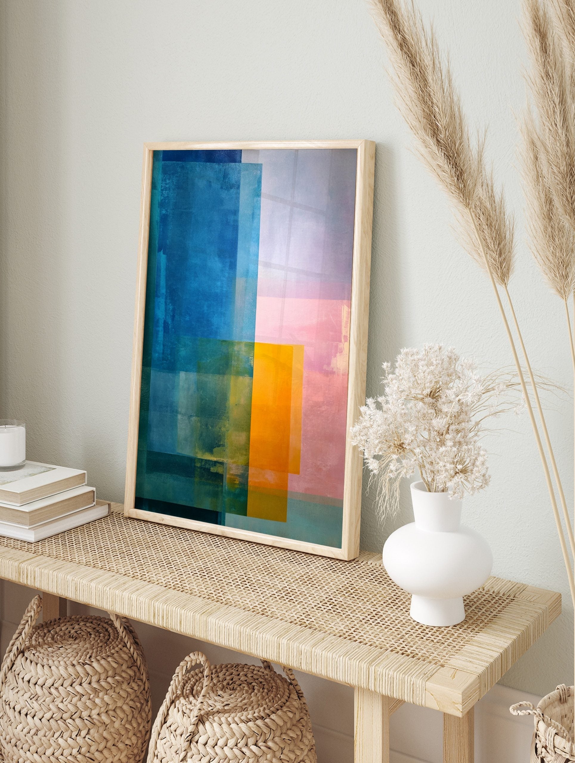 Abstract colour block art print with overlapping rectangles in blue, orange, and pink hues, in an alternate framed mockup
