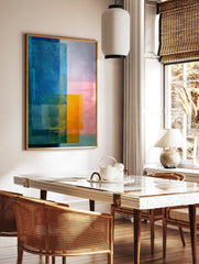 Abstract colour block art print with overlapping rectangles in blue, orange, and pink hues, modern, in a styled room mockup