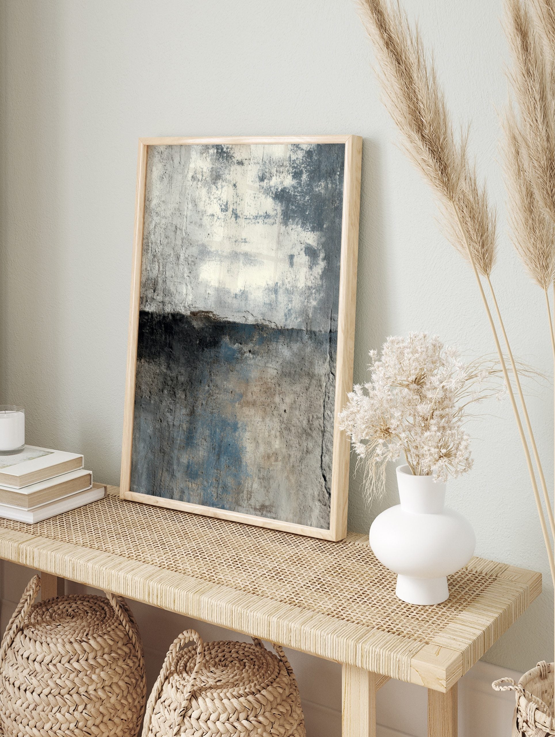 Abstract distressed wall art print with grey, off-white, and blue textured surface, divided, in an alternate framed mockup