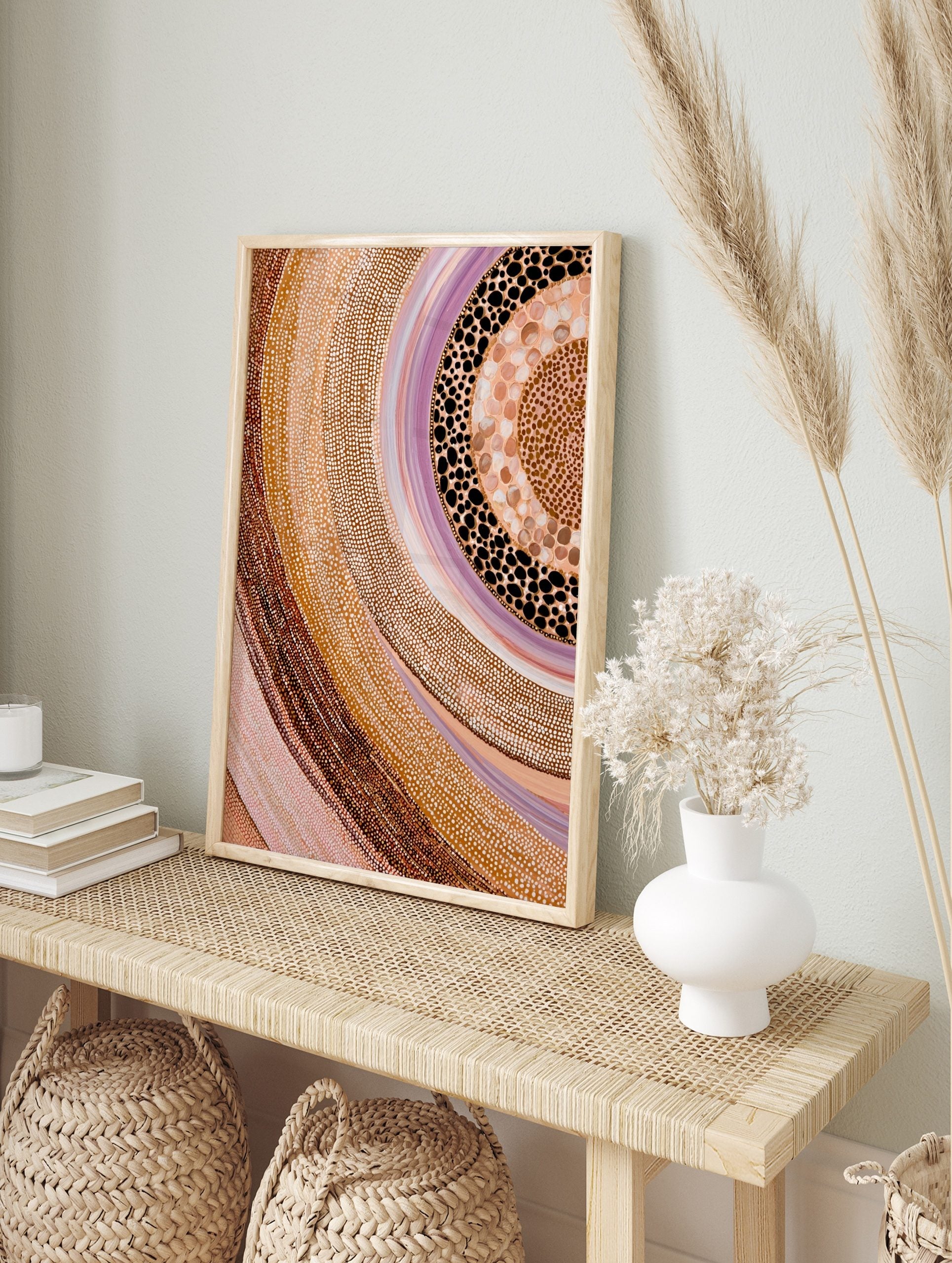 Abstract dot painting wall art with swirling bands of earthy browns, beiges, pinks, whites, in an alternate framed mockup