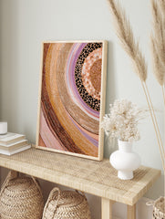 Abstract dot painting wall art with swirling bands of earthy browns, beiges, pinks, whites, in an alternate framed mockup