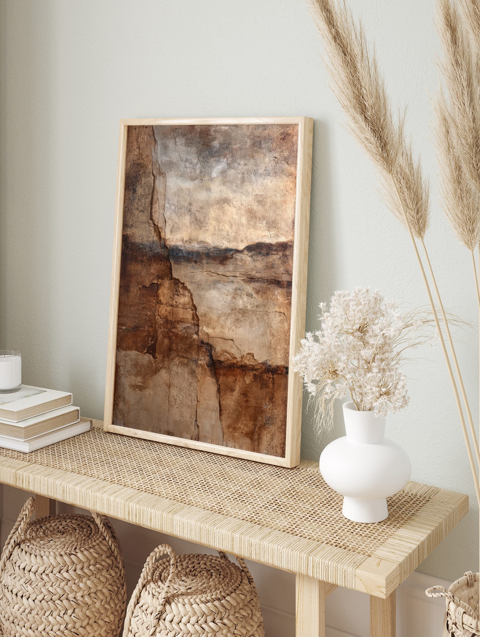 Abstract wall art print with deep cracks and layered textures in brown, beige, and dark earth, in an alternate framed mockup