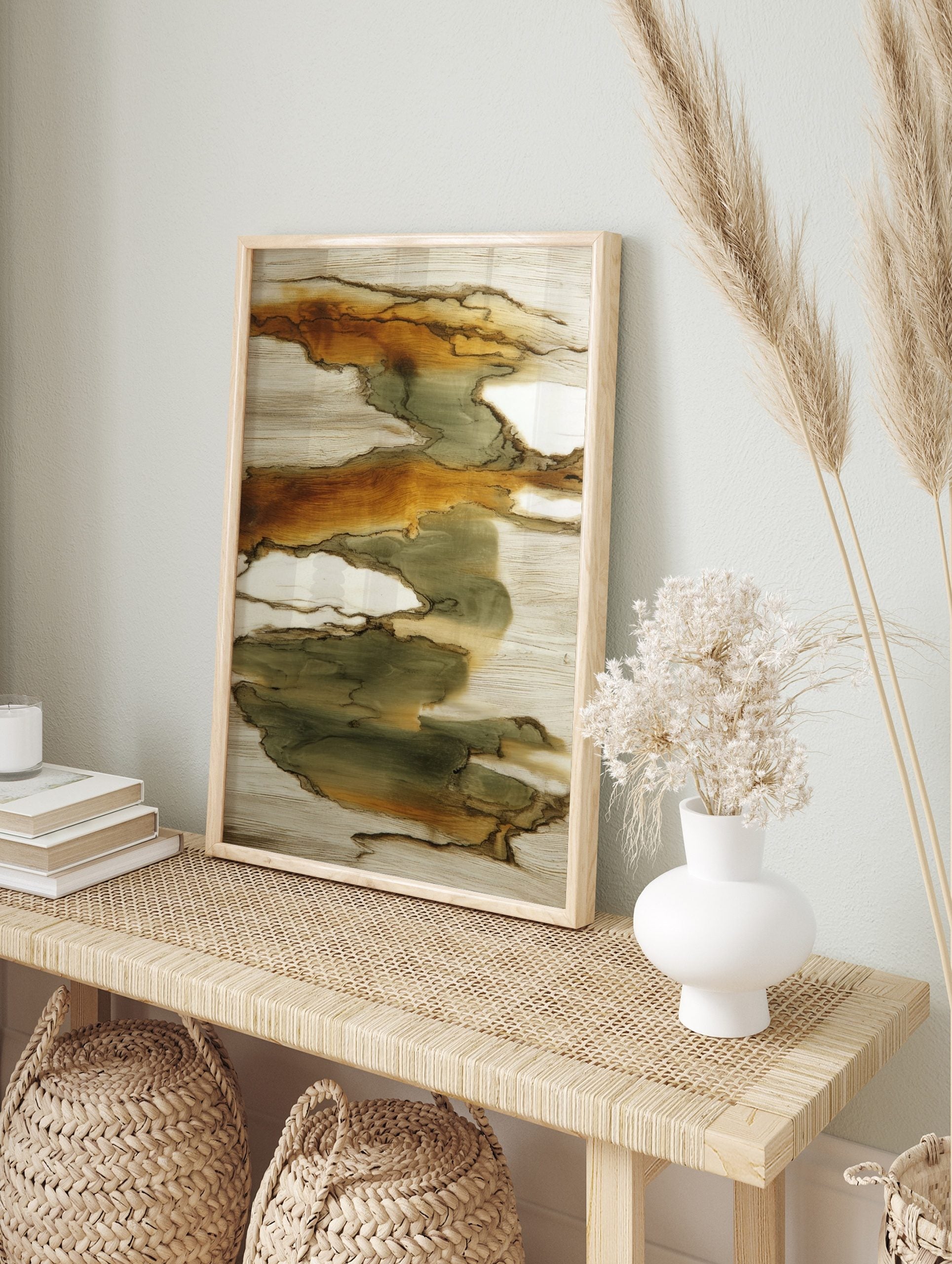 Abstract art print with organic flowing shapes in earthy green, brown, and beige tones, in an alternate framed mockup