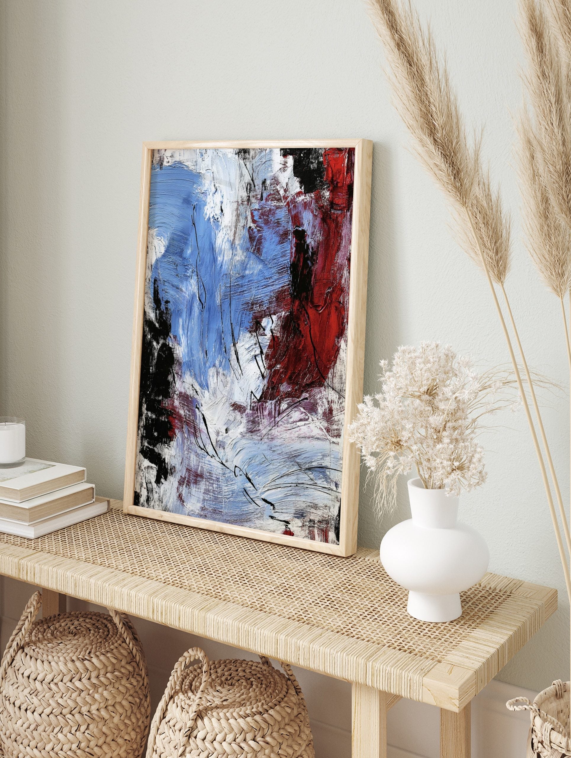 Abstract expressionist art print with bold blue, red, black, and white textured brushstrokes, in an alternate framed mockup
