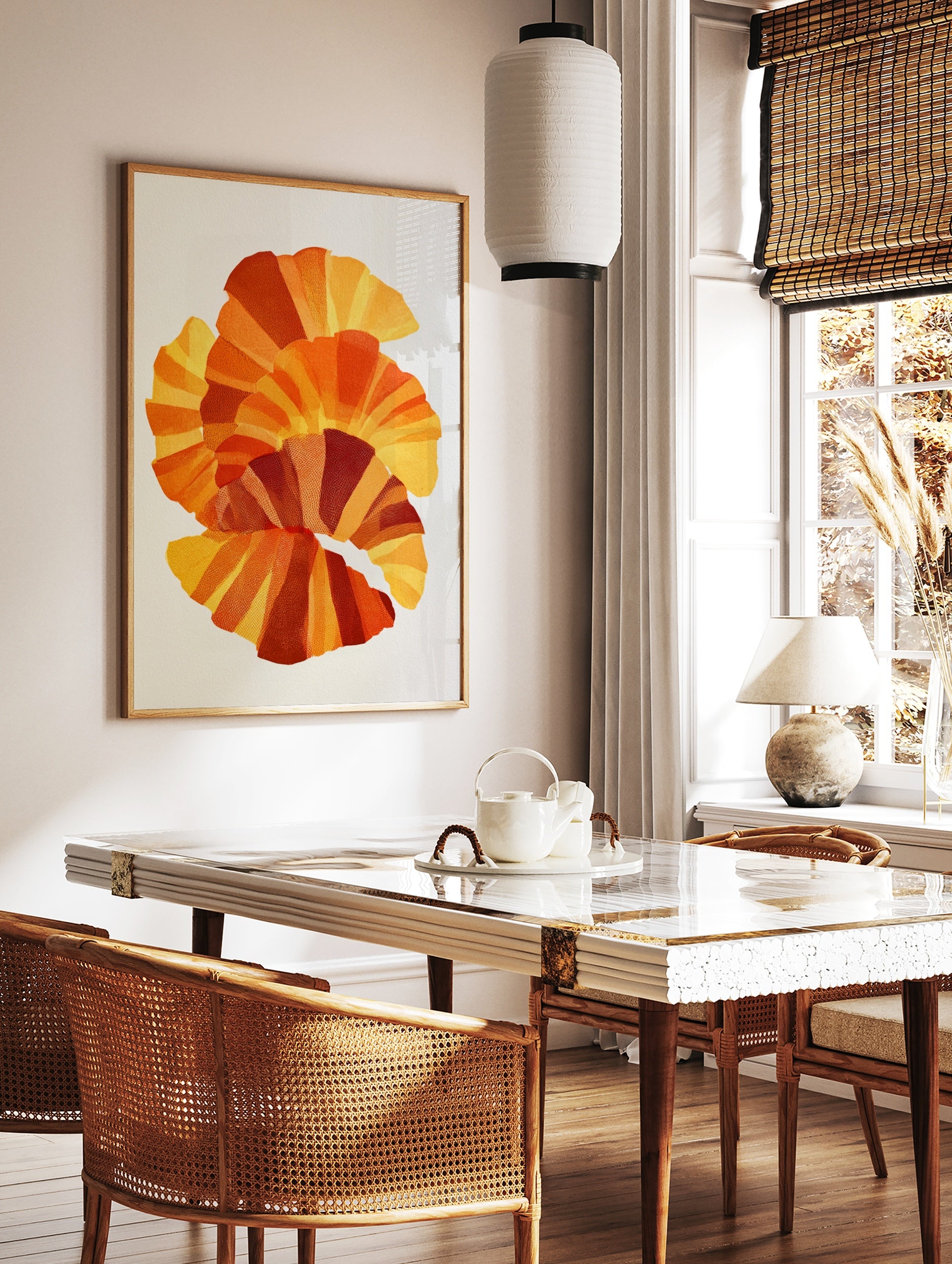 Abstract fan-shaped layered geometric art print in yellow, orange, and red with stippled texture on, in a styled room mockup