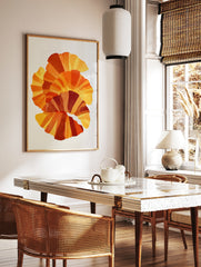 Abstract fan-shaped layered geometric art print in yellow, orange, and red with stippled texture on, in a styled room mockup