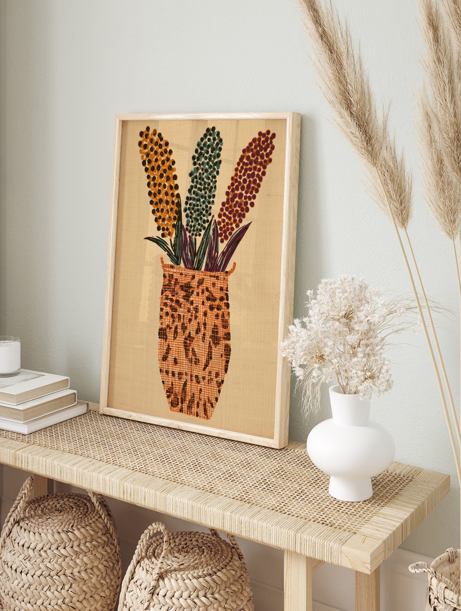 Abstract floral vase wall art with three dotted flower stalks in orange, teal, and purple on, in an alternate framed mockup