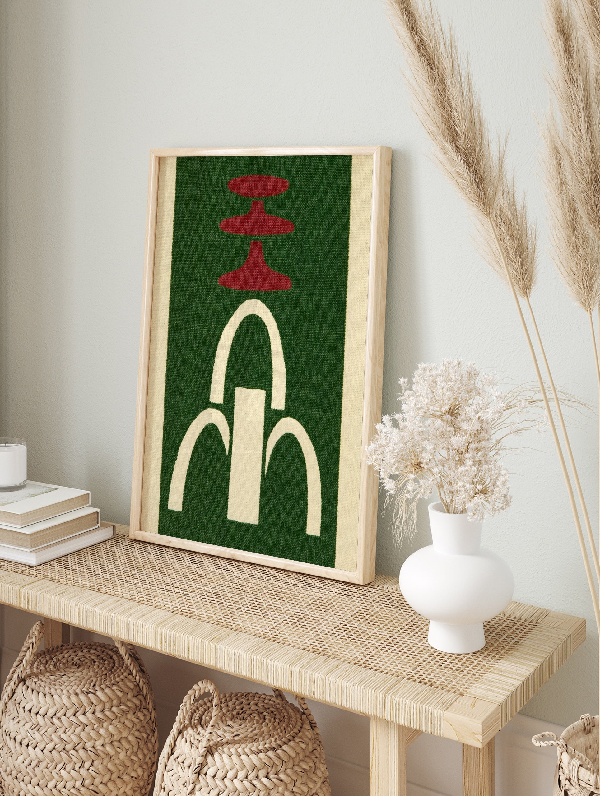 Abstract wall art with red tiered shapes and a white arched fountain motif on a green, in an alternate framed mockup