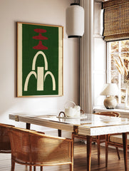 Abstract wall art with red tiered shapes and a white arched fountain motif on a green textured, in a styled room mockup