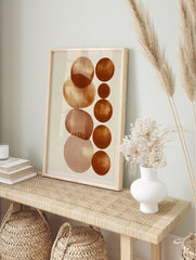 Abstract geometric wall art with vertical terracotta circles and line patterns on a cream, in an alternate framed mockup