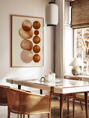 Abstract geometric wall art with vertical terracotta circles and line patterns on a cream background, in a styled room mockup