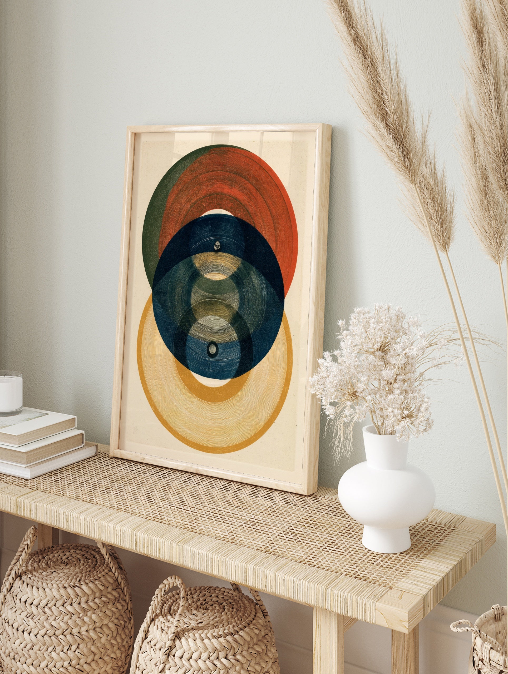 Abstract geometric wall art print featuring overlapping circles in red, blue, and yellow with, in an alternate framed mockup