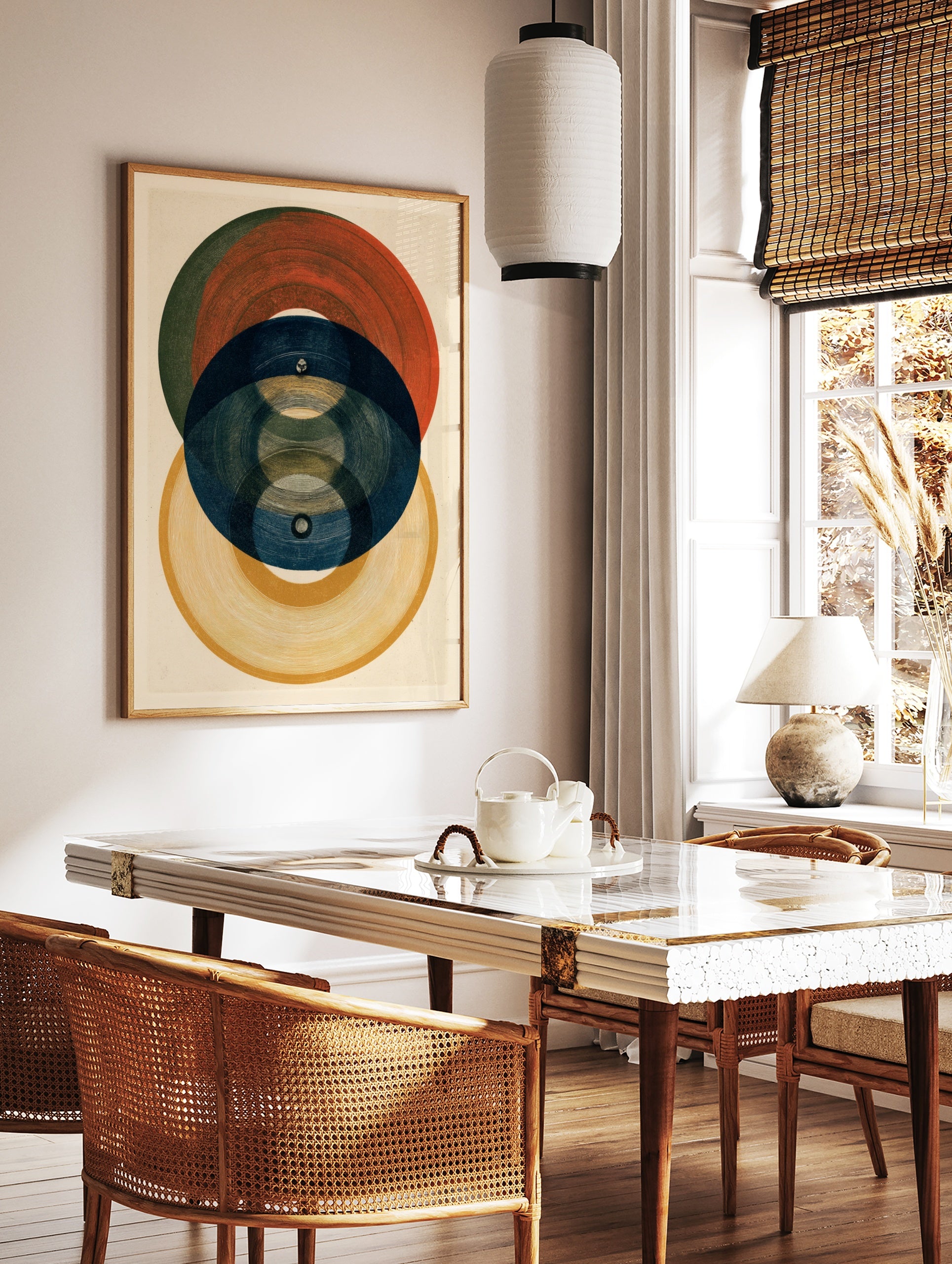 Abstract geometric wall art print featuring overlapping circles in red, blue, and yellow with, in a styled room mockup