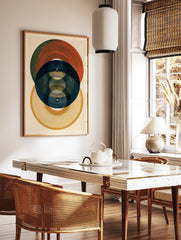 Abstract geometric wall art print featuring overlapping circles in red, blue, and yellow with, in a styled room mockup
