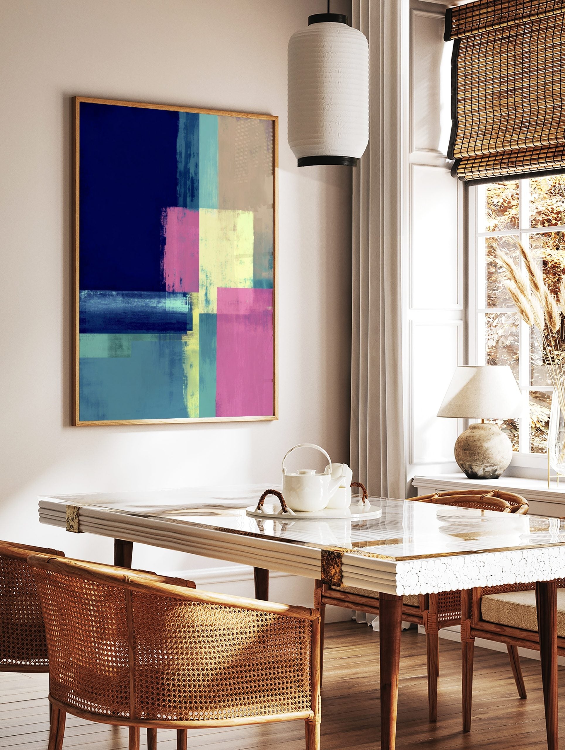 Abstract geometric art print with blocks of navy blue, teal, pink, and yellow with a distressed, in a styled room mockup