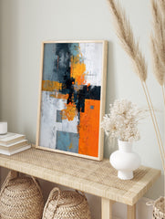 Abstract geometric wall art with orange, grey, black, and white blocks, distressed textures, in an alternate framed mockup