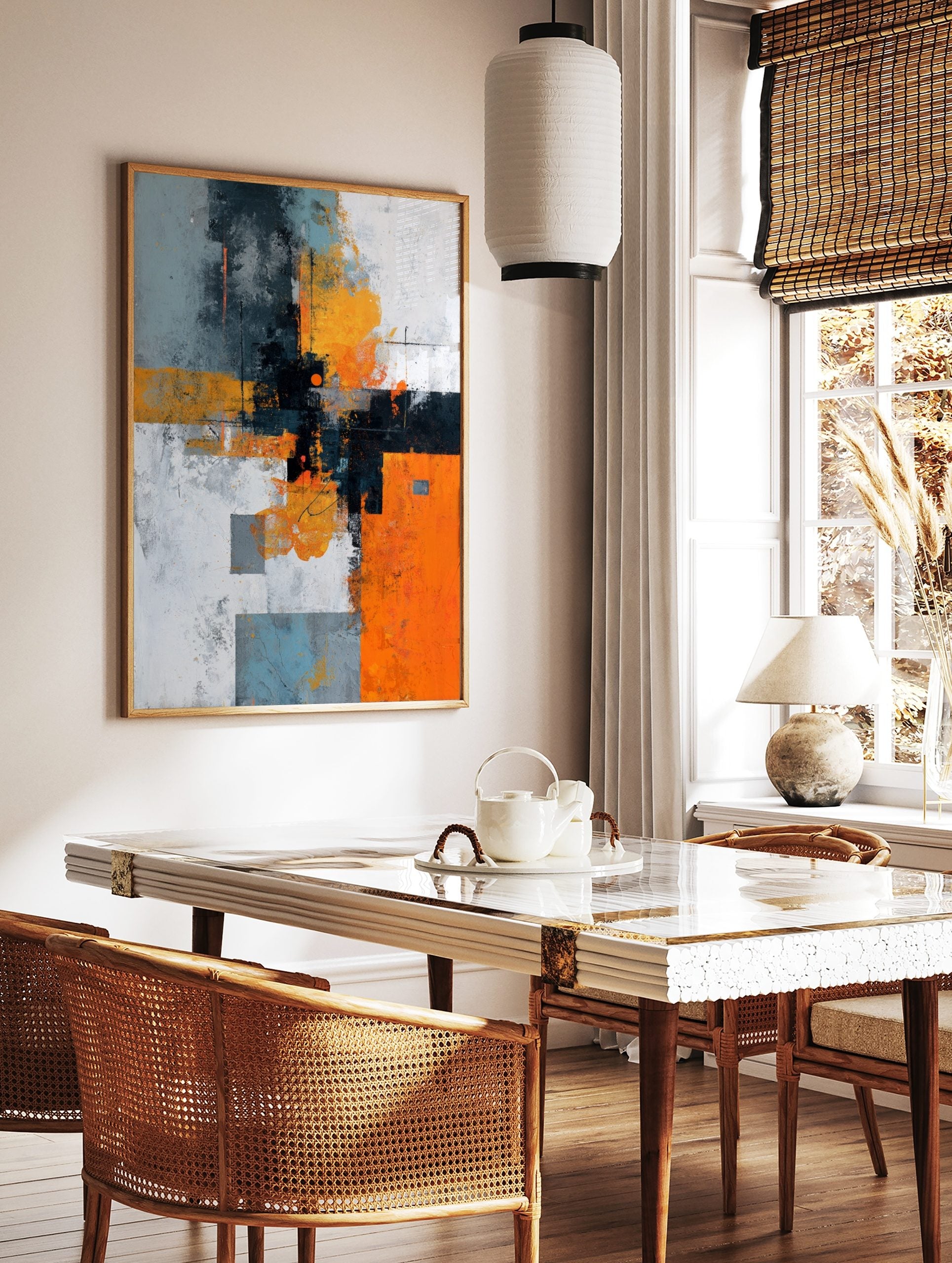 Abstract geometric wall art with orange, grey, black, and white blocks, distressed textures, and an, in a styled room mockup